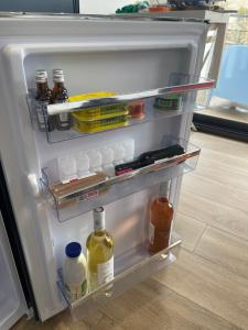 an open refrigerator filled with lots of food and drinks at Carro Zen in Martigues
