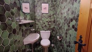 a small bathroom with a toilet and a sink at Majestic 424 in Bagnes