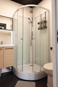 a shower with a glass enclosure in a bathroom at Studio Cocoon in Colombey-les-Belles