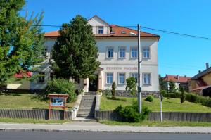 a building on the side of a street at Penzion Poodří in Suchdol nad Odrou