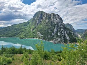 a view of a mountain and a lake at Cozy Apartment, Free Parking near Dajti Cable Car, Bunk'Art in Tirana