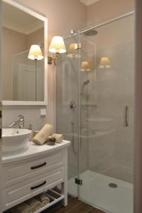 a bathroom with a glass shower and a sink at City Centre Dream place in Zagreb +27 photos