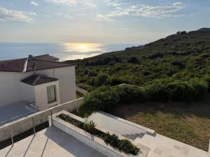 a view of the ocean from the balcony of a house at Villa Max in Krimovice