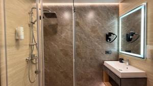 a bathroom with a shower and a sink at Готель Гоголь in Poltava +49 photos