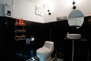 a black and white bathroom with a toilet and a sink at Dream Villa Beachside Sunset in Ban Bang Po +51 photos