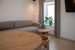 a living room with a couch and a table at Fonte Perila House in Funtana