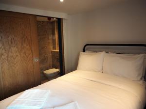 A bed or beds in a room at St Christopher's Liverpool Street
