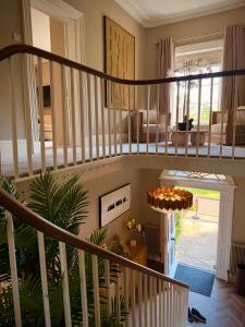 a spiral staircase in a home with a living room at La Mancha Hall Stately Home in Halsall
