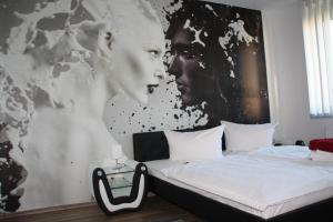 Posteľ alebo postele v izbe v ubytovaní City-Hotel