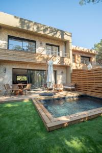 a house with a swimming pool in the yard at Strada Rossa in Lecci