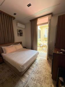 a bedroom with a bed and a door to a patio at Excellent Location cairo in Cairo