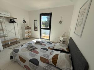 a bedroom with a large bed in a room at Villa ROC in Bandol