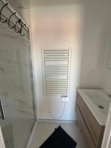 a bathroom with a shower and a sink at Villa ROC in Bandol