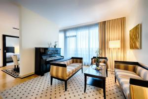 a living room with a couch and a table at Welcome Parkhotel Euskirchen in Euskirchen