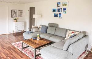 a living room with a couch and a coffee table at Beautiful Home In Holbæk With Wifi in Holbæk