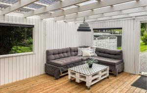 a couch and a table on a patio at Beautiful Home In Holbæk With Wifi in Holbæk
