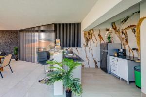 a kitchen with a plant in a room at Panorama Coastal Haven in Split