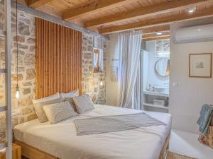 a bedroom with a large bed and a bath tub at Dolce Terra in Stari Grad +106 photos