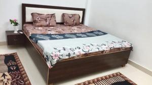 a bedroom with a bed with at Pandeyji stay in Ayodhya