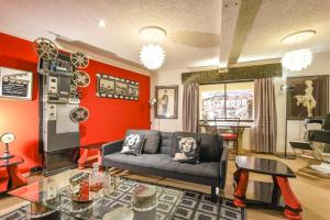 a living room with a couch and a table at Villa Simonne in Johannesburg