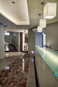 a lobby with a glass counter in a building at K Hotel - Yunghe in Yonghe