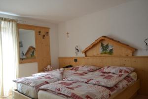 Posteľ alebo postele v izbe v ubytovaní Albergo Aurora