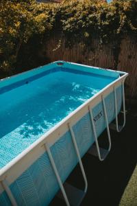 an empty swimming pool in a yard at The White Hill Guesthouse in Yeroẖam +131 photos