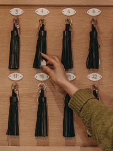 a person taking a picture of clocks on a wall at Hôtel Le Monal in Sainte-Foy-Tarentaise +48 photos