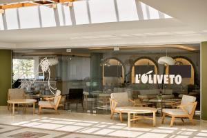 a store with tables and chairs in a room at Iberostar Waves Creta Panorama & Mare in Panormos Rethymno