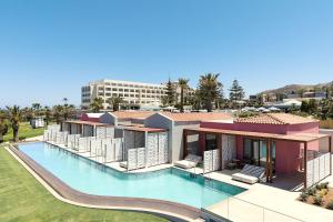 an aerial view of a resort with a swimming pool at Iberostar Waves Creta Panorama & Mare in Panormos Rethymno