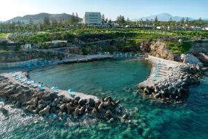 a group of rocks in the water at a resort at Iberostar Waves Creta Panorama & Mare in Panormos Rethymno