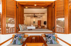 a room with a bed and a table and chairs at The Jam Boutique Hotel in Luang Prabang