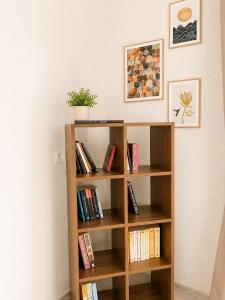a book shelf filled with books in a room at Apart Portakal Çiçeği in Kaş
