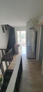 a living room with stairs and a refrigerator at Tomorrowlandhome Boom in Boom