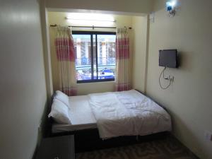 Katil atau katil-katil dalam bilik di Hotel Sunflower