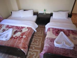 Katil atau katil-katil dalam bilik di Hotel Sunflower