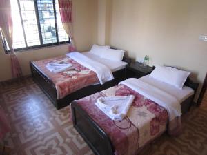 Katil atau katil-katil dalam bilik di Hotel Sunflower