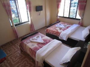 Katil atau katil-katil dalam bilik di Hotel Sunflower