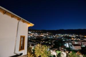 a view of a city at night at Old Street Villa in Gjirokastër