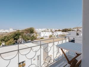 a balcony with a view of a city at Kamara House - 200m from Naoussa Port in Naousa