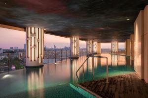 a swimming pool on the top of a building at Vasa Suite Surabaya in Surabaya