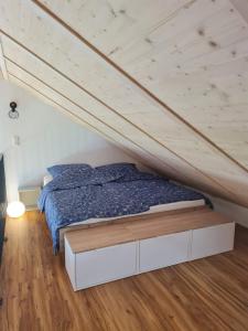 a bedroom with a bed in a attic at 5lakes & nature in Starnberg