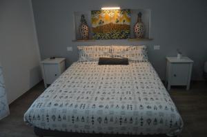 Postel nebo postele na pokoji v ubytování B&B Maison Blanche