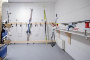 a room with a bunch of tools on a wall at Hemavan Mountain Lodge Jofjället in Hemavan