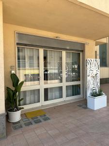 a large sliding glass door in a building at La Casa di Aira in Martina Franca