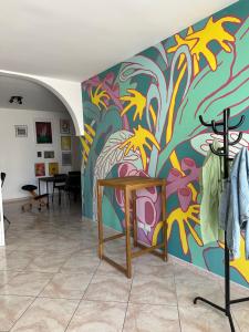 a room with a painting on the wall at La Casa di Aira in Martina Franca