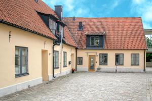 a group of buildings with red roofs at Apartments Strandgatan Visby in Visby