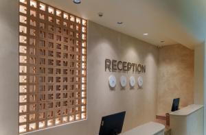 an office with a reception desk and a window at GRIFID Arabella Hotel - Ultra All inclusive & Aquapark in Golden Sands +78 photos