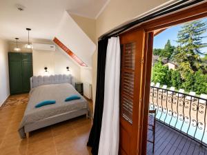 a bedroom with a bed and a balcony at Marina Panzio in Siófok +61 photos