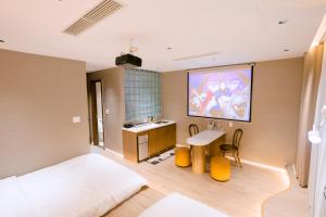 a bedroom with a bed and a desk and a table at UMEE Homestay in Thôn Trường Giang